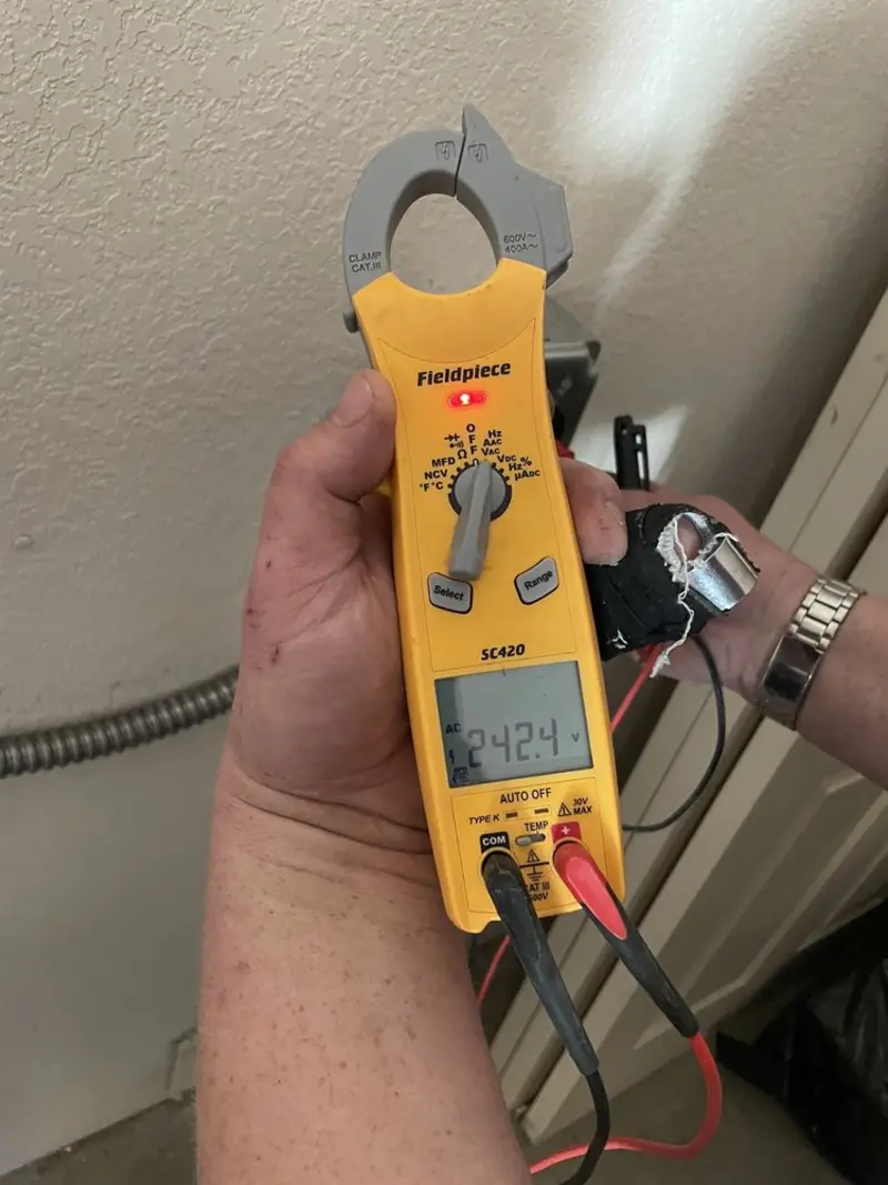Voltage testing with clamp meter during Outlet Installation in Salisbury